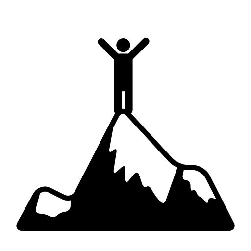 Person standing on top of a mountain