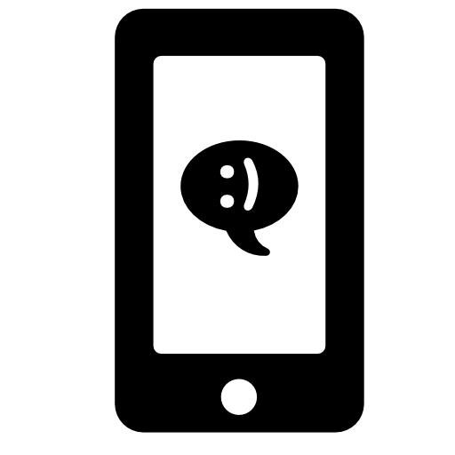 Speech bubble chat message with a smile symbol on phone screen